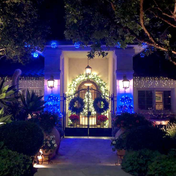 Christmas Lighting in city with lights on buildings and trees